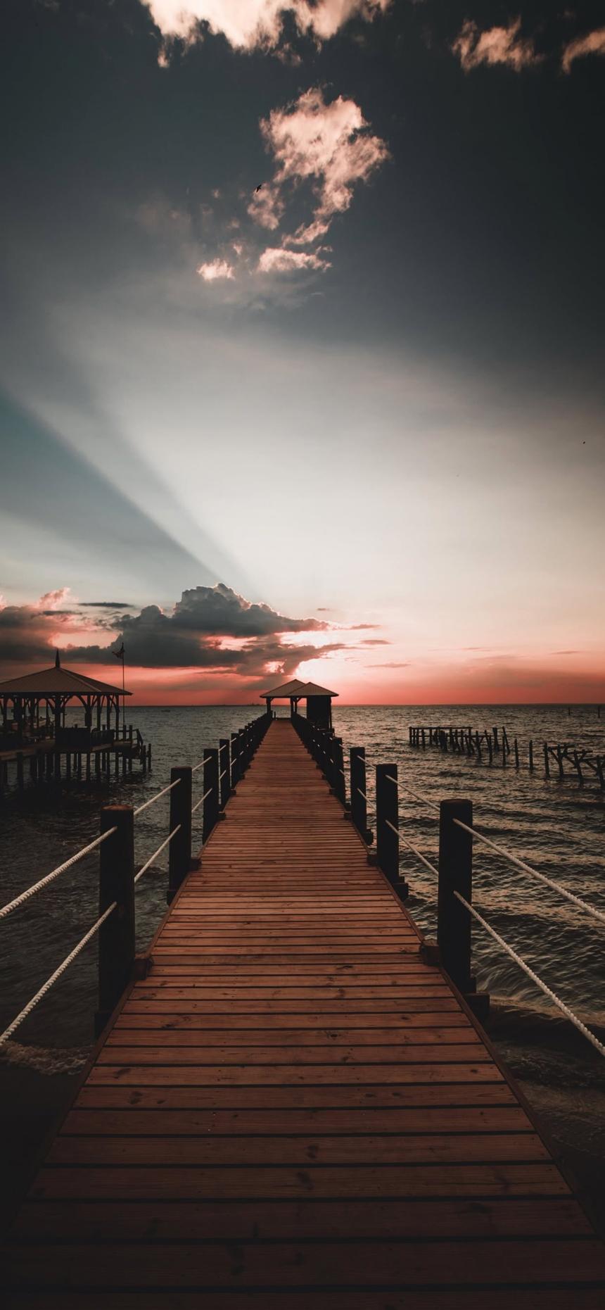 Serene Ocean Pier Sunset Wallpaper 4K